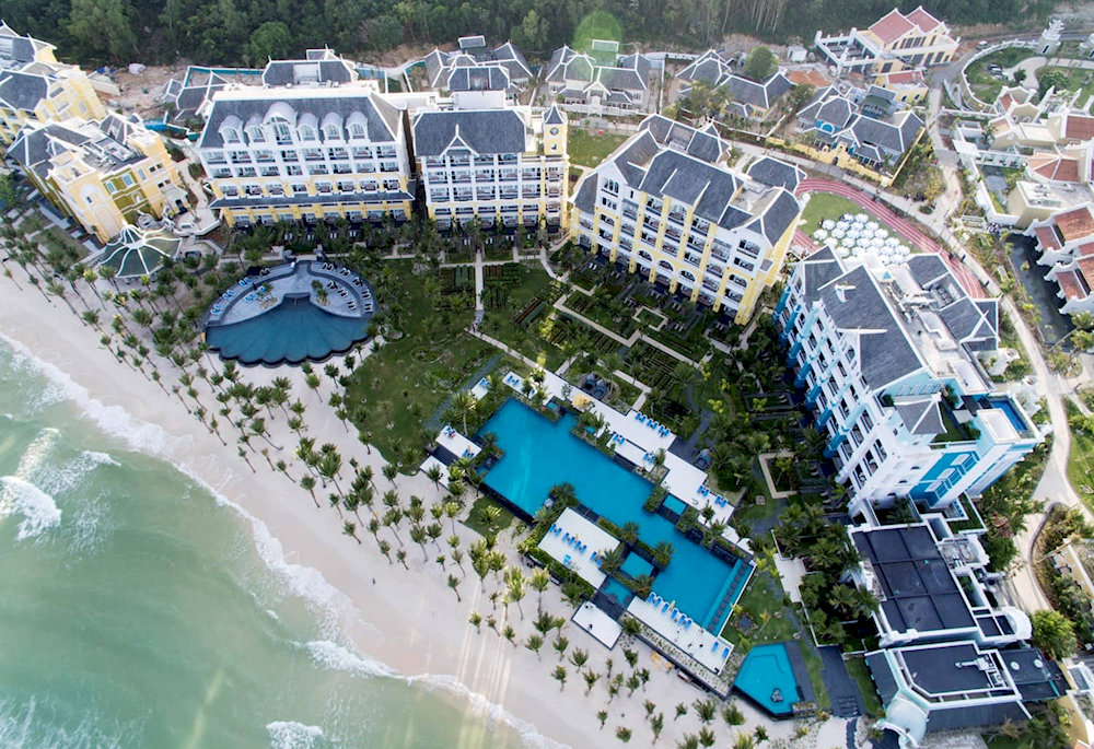 JW Marriott Phu Quoc Emerald Bay showcases stunning French colonial architecture along Khem Beach, featuring overwater villas and world-class amenities